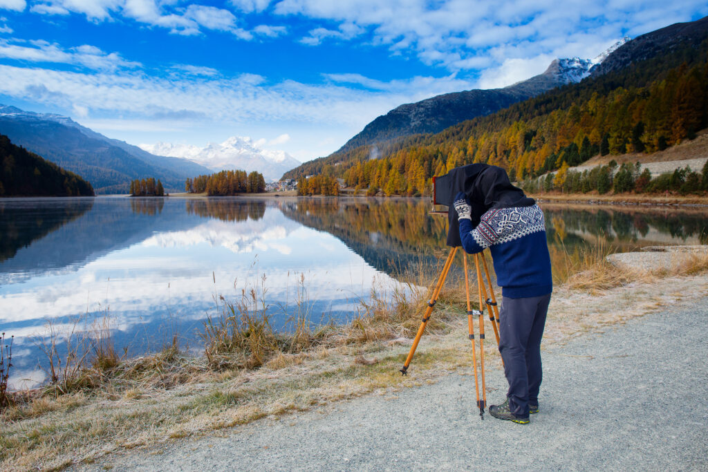 Landscape photographer with medium format vintage film plate camera.
